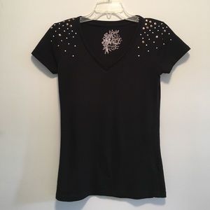 Black top with gold and silver details