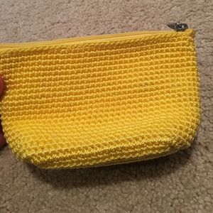 A bright yellow sak pouch