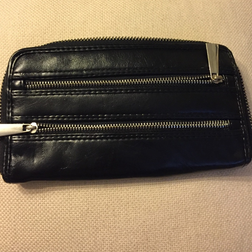 Black wallet. Has dents