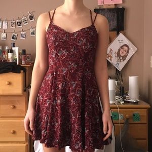 Red dress with blue and white flower designs.