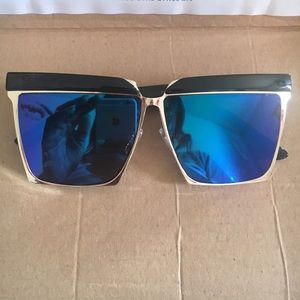 Blue lens gold rim sunglasses