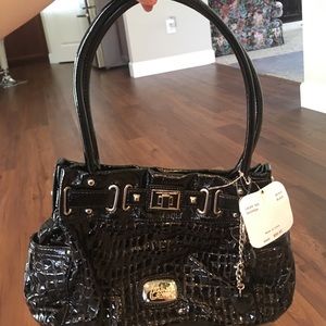 New with tag Kathy Van Zeeland purse.