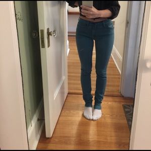 Teal colored skinny jeans