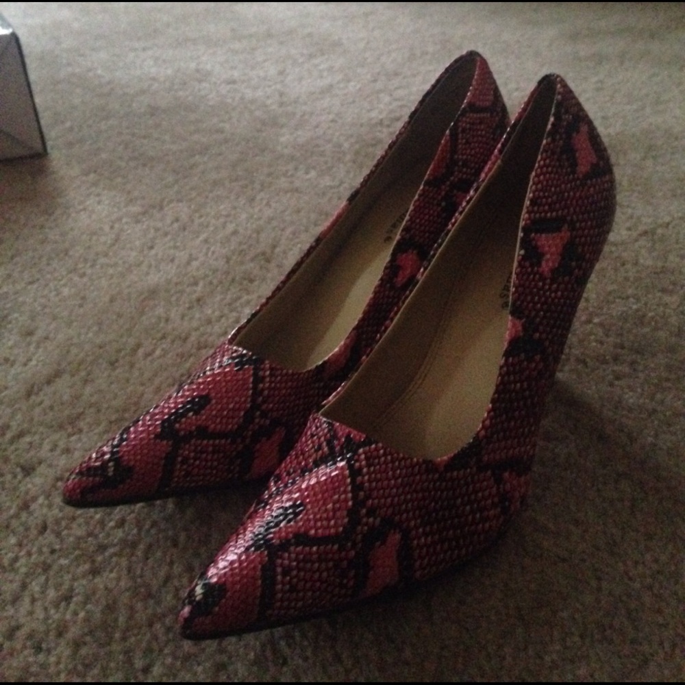 Pink and black pointed heels