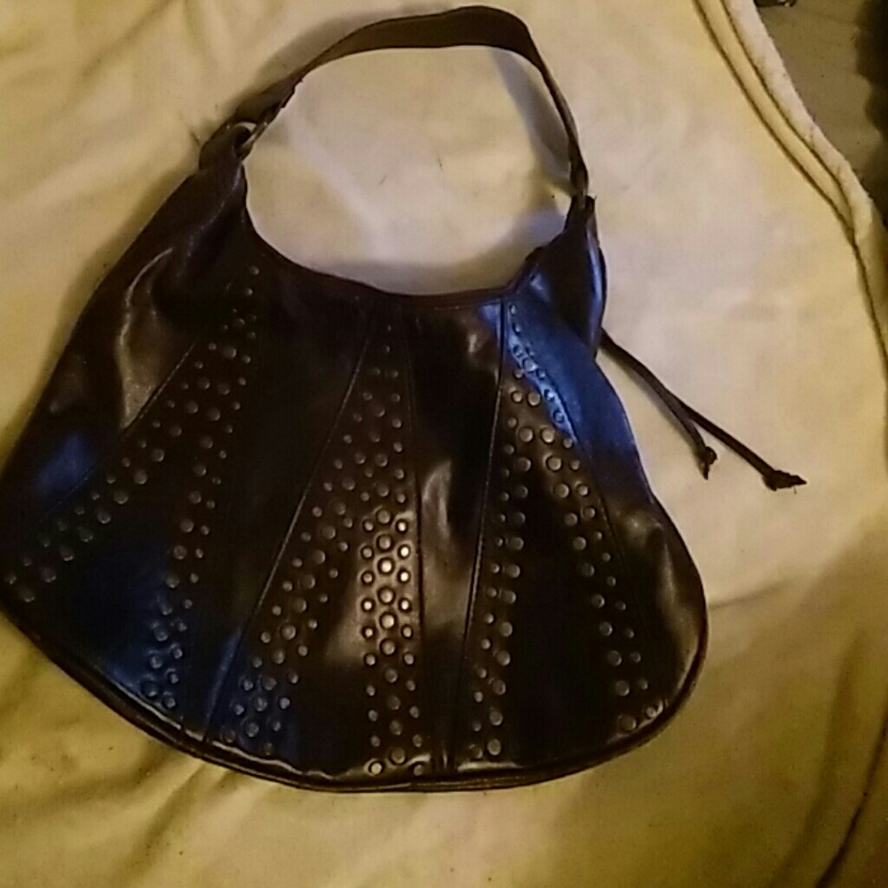 Brown purse bronze studs on it.