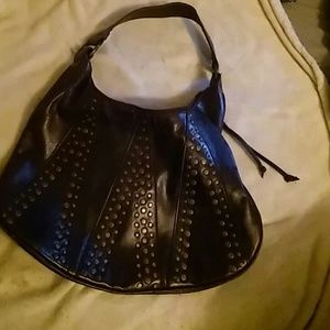 Brown purse bronze studs on it.