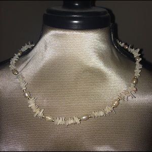 White shell necklace.
