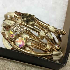 Gold tone & leather bracelet with pretty charms