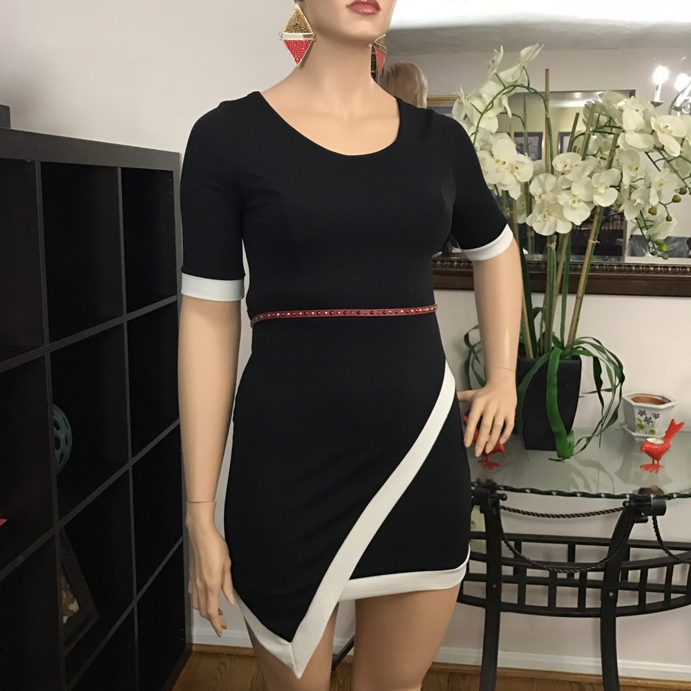 Brand new black dress with white trim. Size L