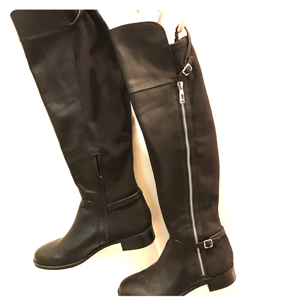 Black Ivanka Trump knee high boots.