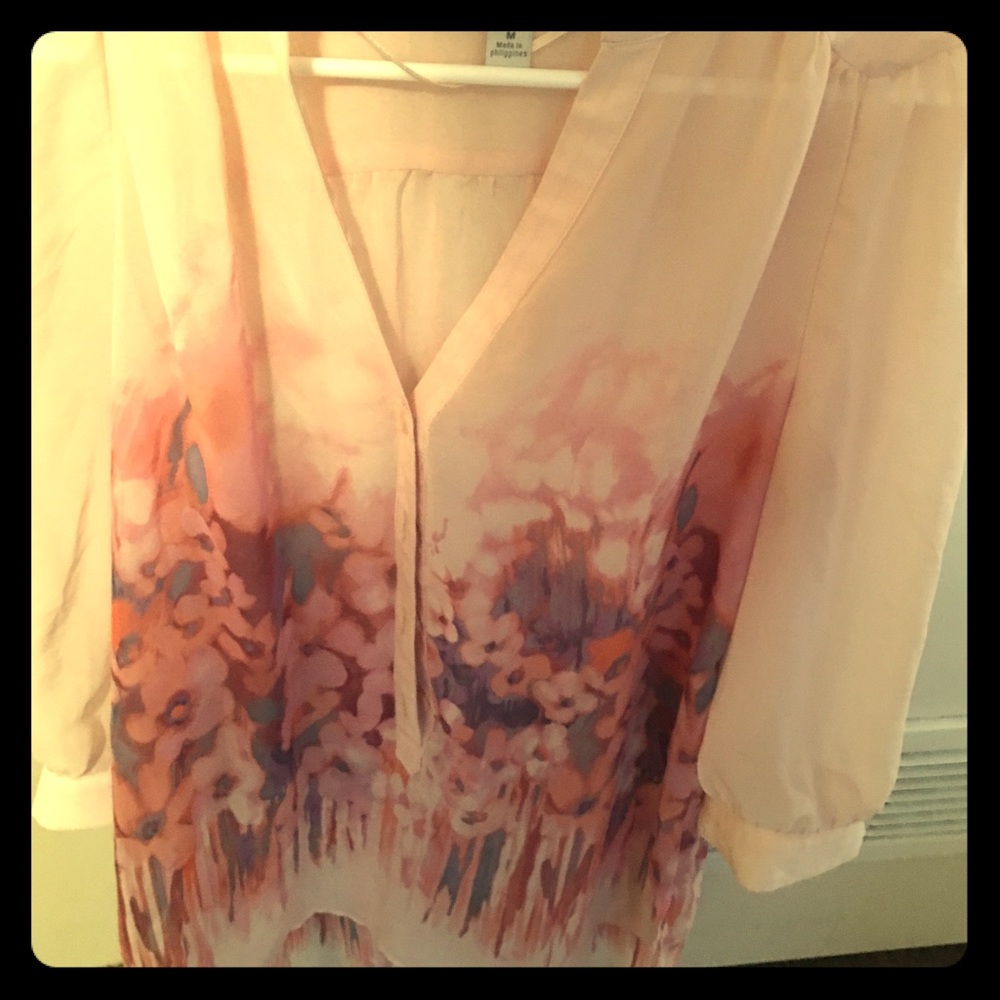 Floral print sheer blouse.