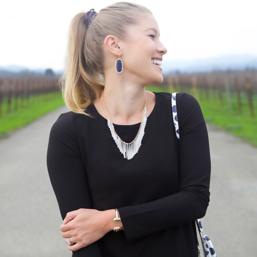 White fringe tassel necklace.
