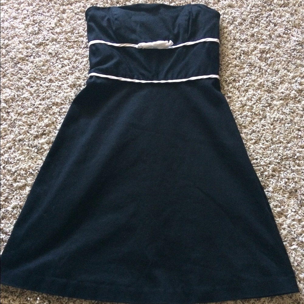 Black strapless WHBM dress with bow accent.
