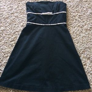 Black strapless WHBM dress with bow accent.