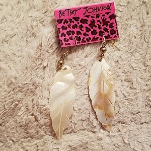 feather earrings.