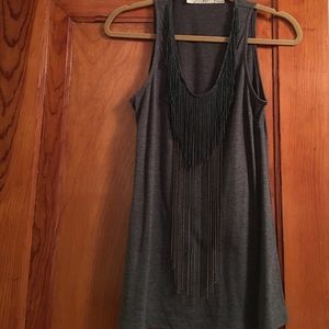 Tank with fringe and chain detail.