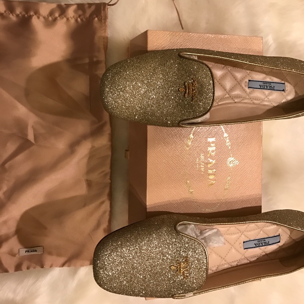 Gold Prada loafers