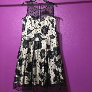 beige dress with black rose and polka dots