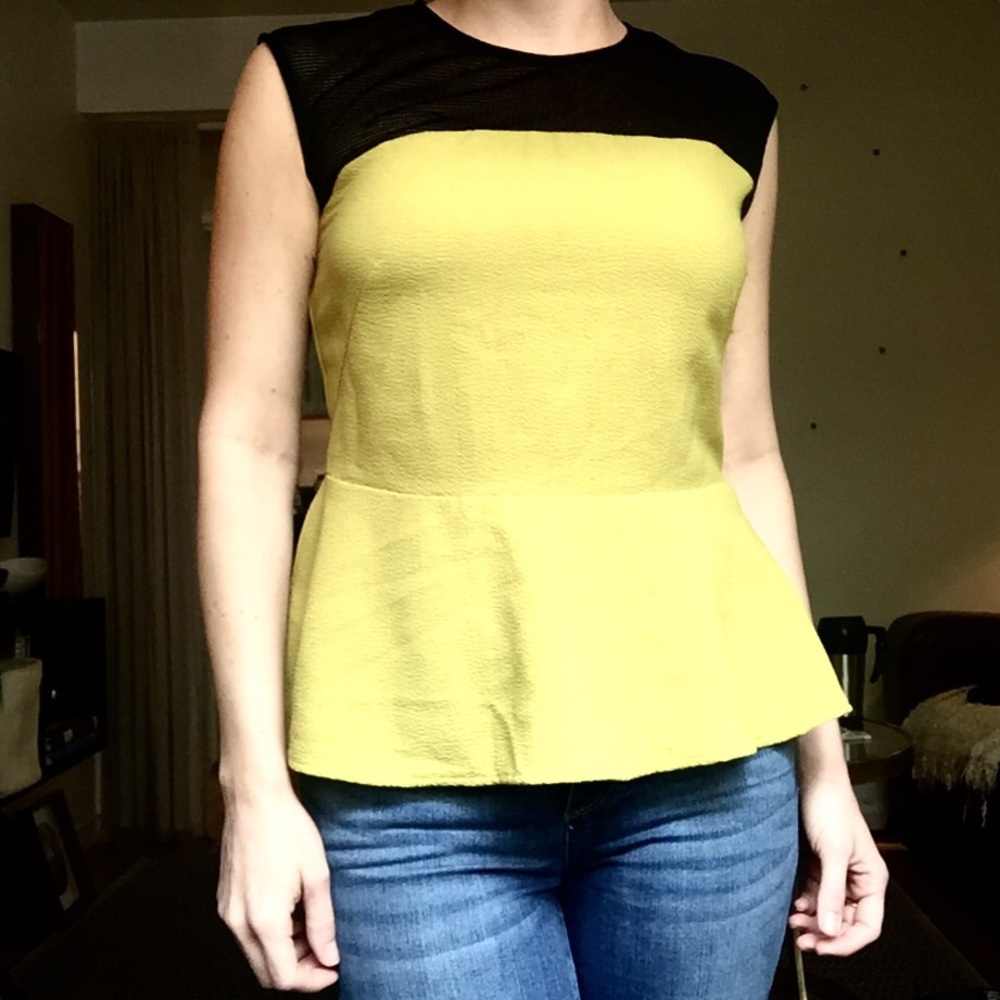 Yellow Peplum top with black mesh panel