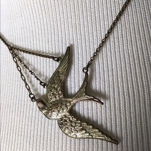 Swooping bird brass necklace