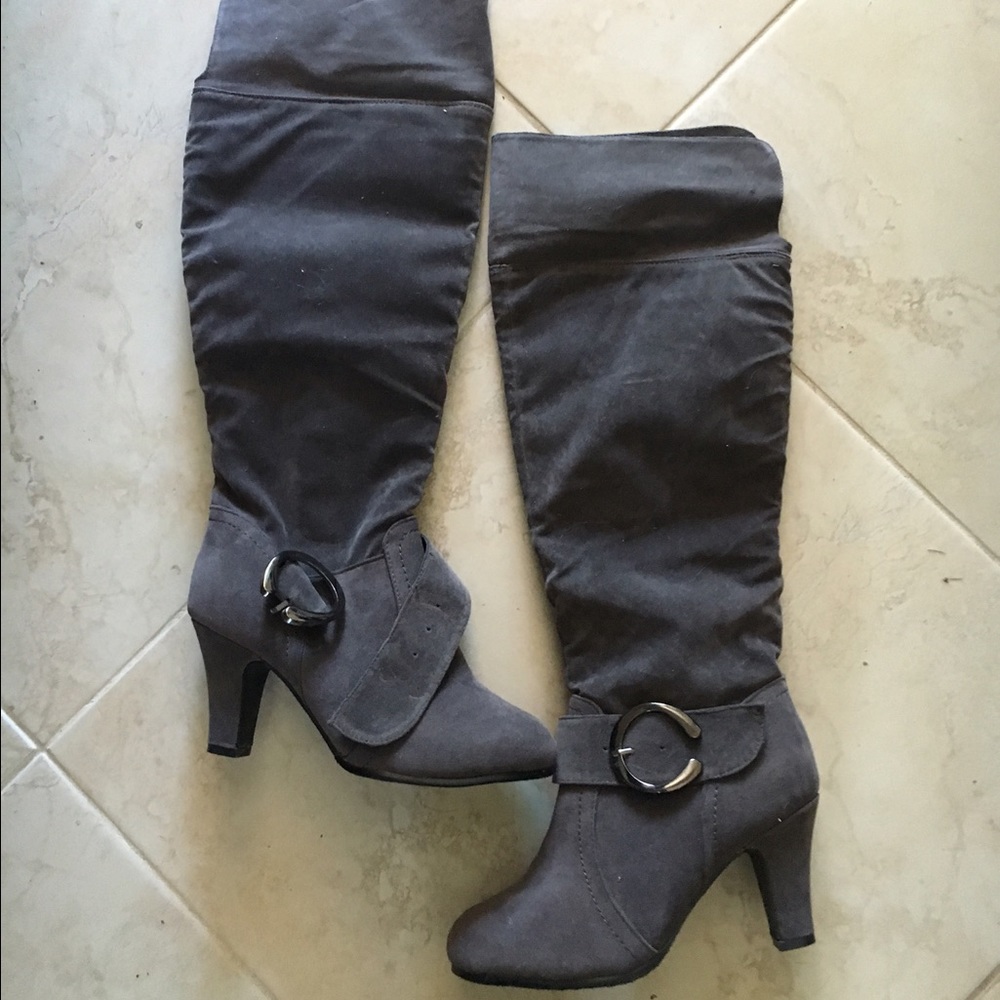 Suede gray over knee boots.