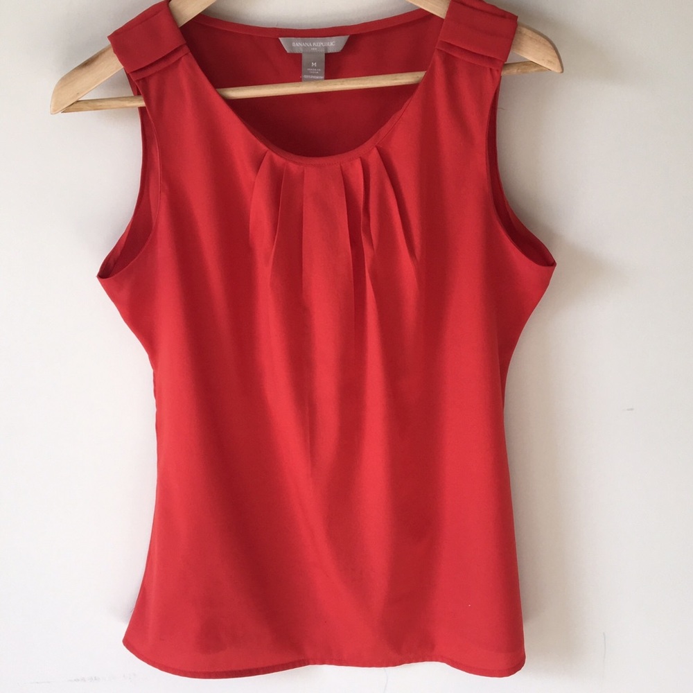 Burnt orange sleeveless blouse