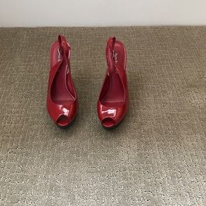 Red heel back pumps