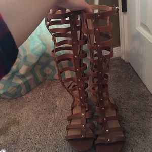 Tan gladiator sandals. Size 9. Gold detailing.