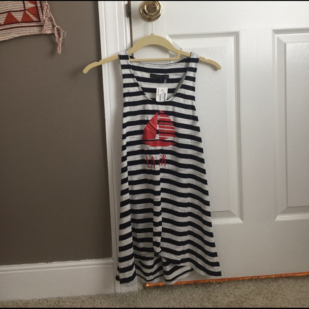 Striped tank, "la mer" written across and sailboat