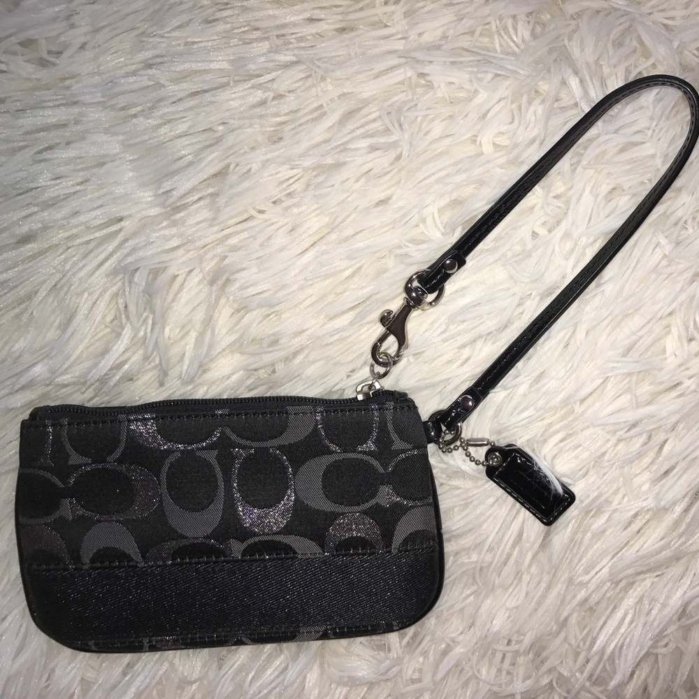 black and silver Coach wristlet