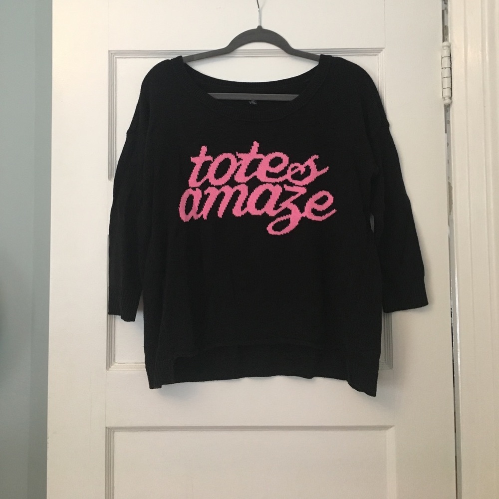 black sweater that says "totes amaze"