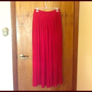 Red pleated maxi skirt