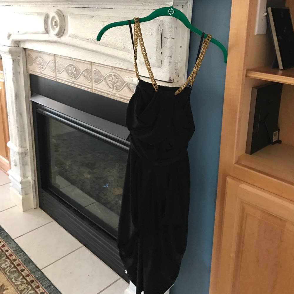 A little black dress with gold chain neckline