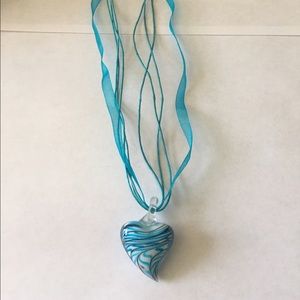 Blown glass heart shaped necklace.