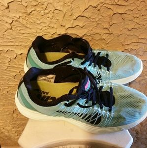 women's light colored nike racing sneakers