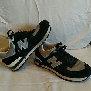 Black, gray, and baby blue New Balance size 7.5
