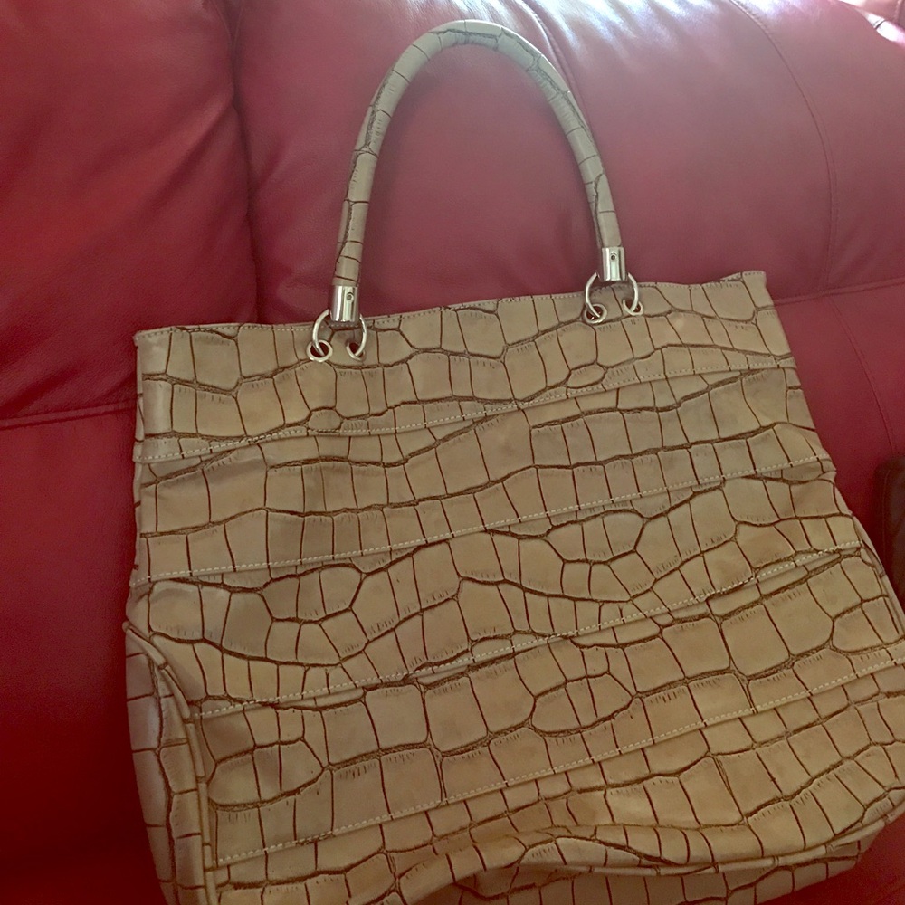 Tan color purse snake skin design