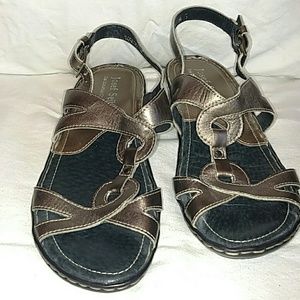 Cute low heal metallic silver leather sandal.