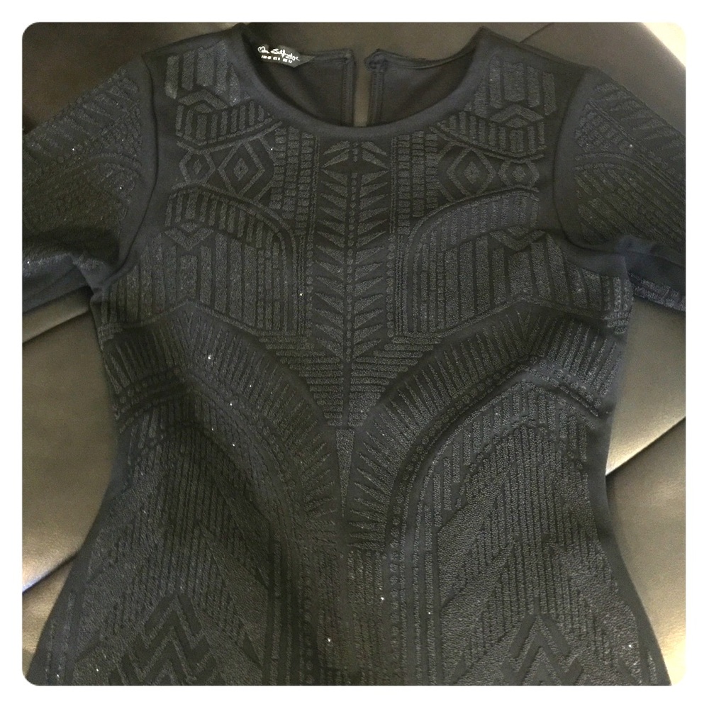 A black embroidered dress
