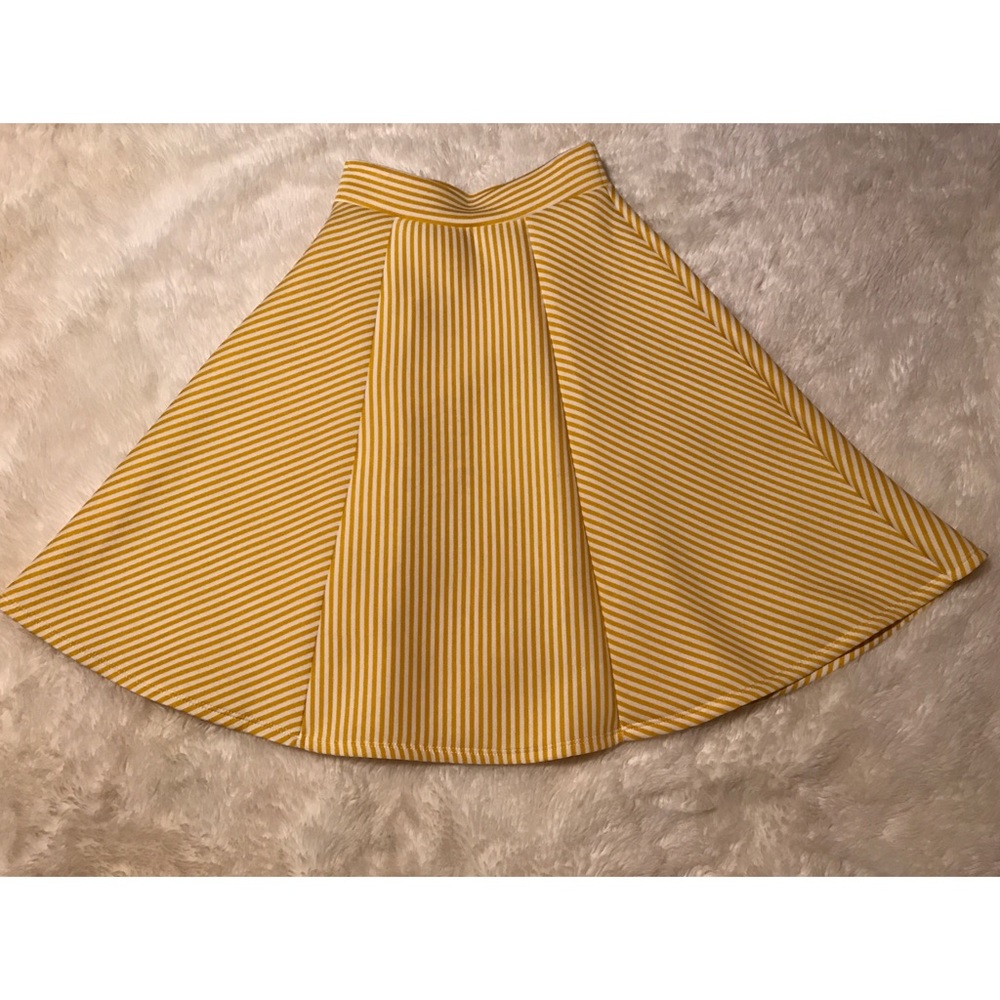 Yellow and white striped circle skirt.