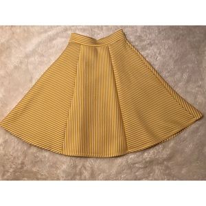 Yellow and white striped circle skirt.