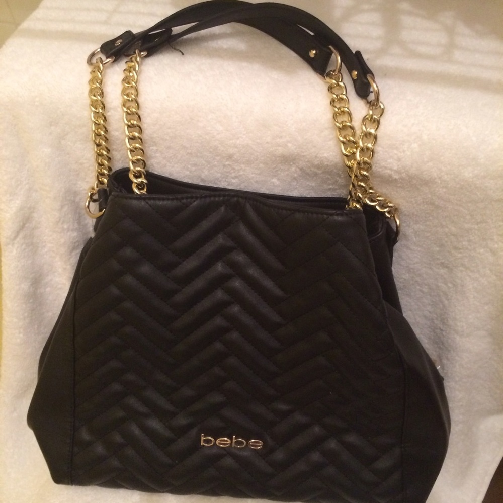 Bebe stylish tote with gold color chains