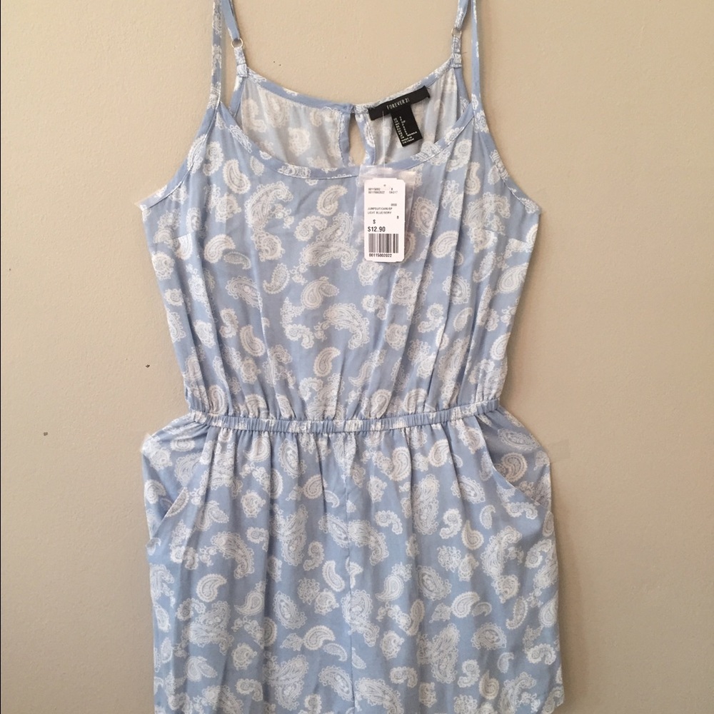 An adorable light blue paisley patterned romper