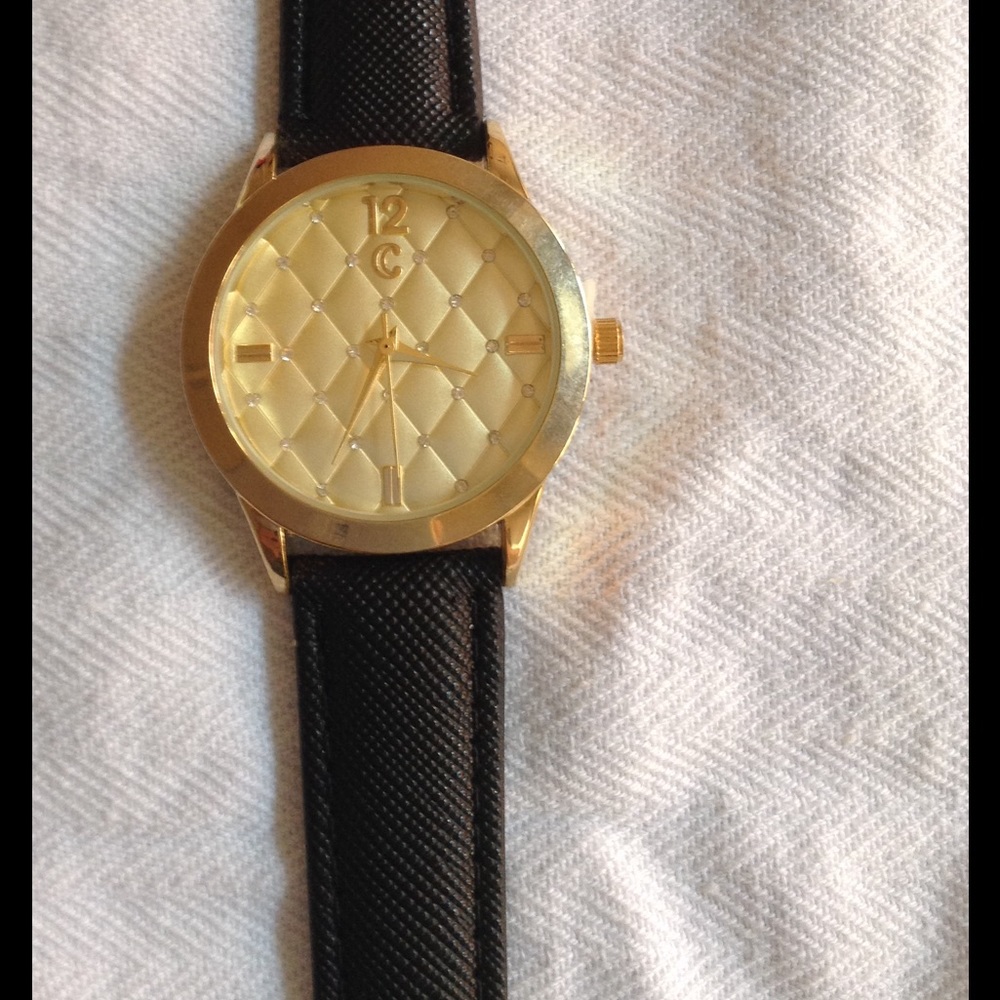 Gold face watch with black band
