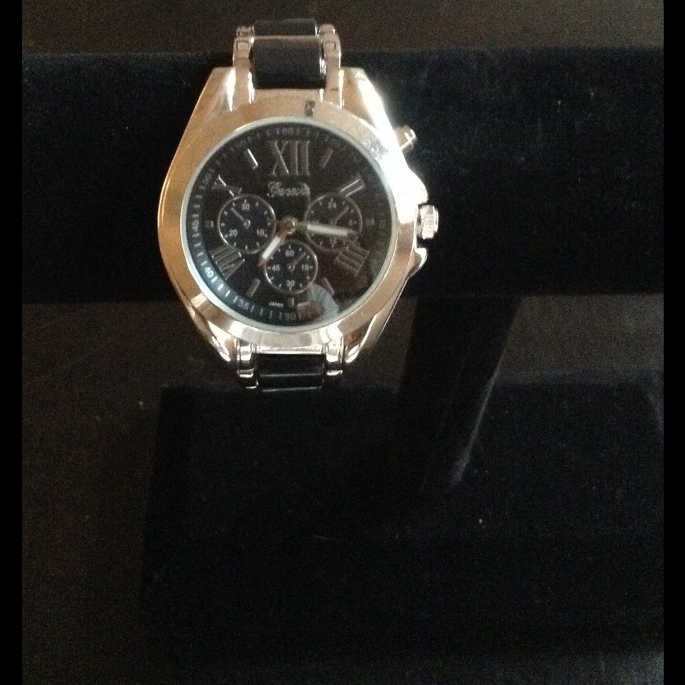 Silver watch with black face