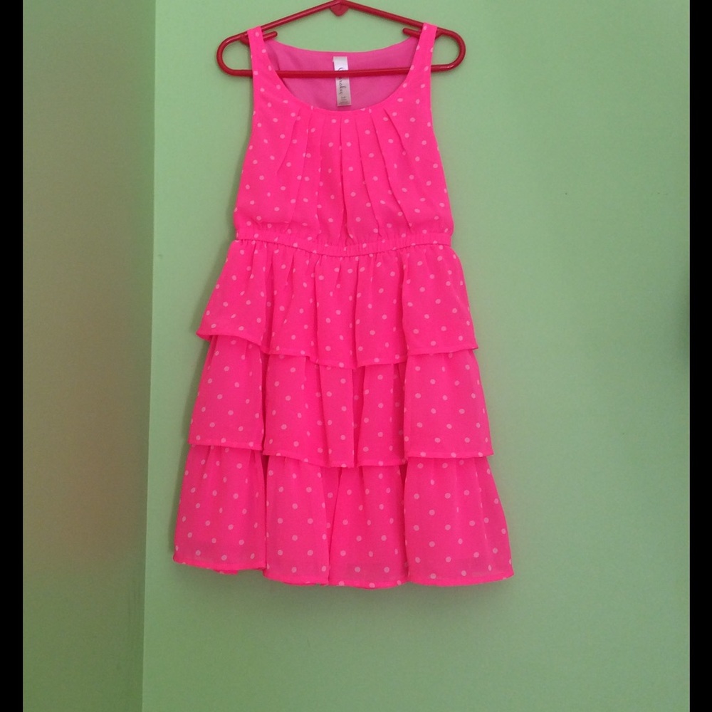 Pink dress with white polka dots.