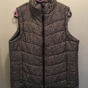 Black and white puffer style vest.