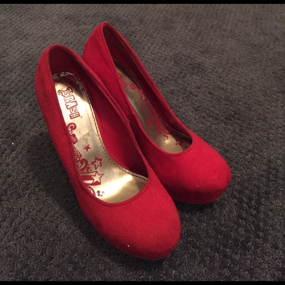 Red platform heeled shoes