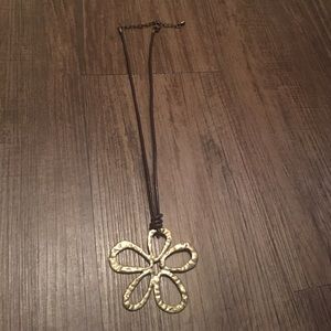 Brown leather necklace with gold flower pendant
