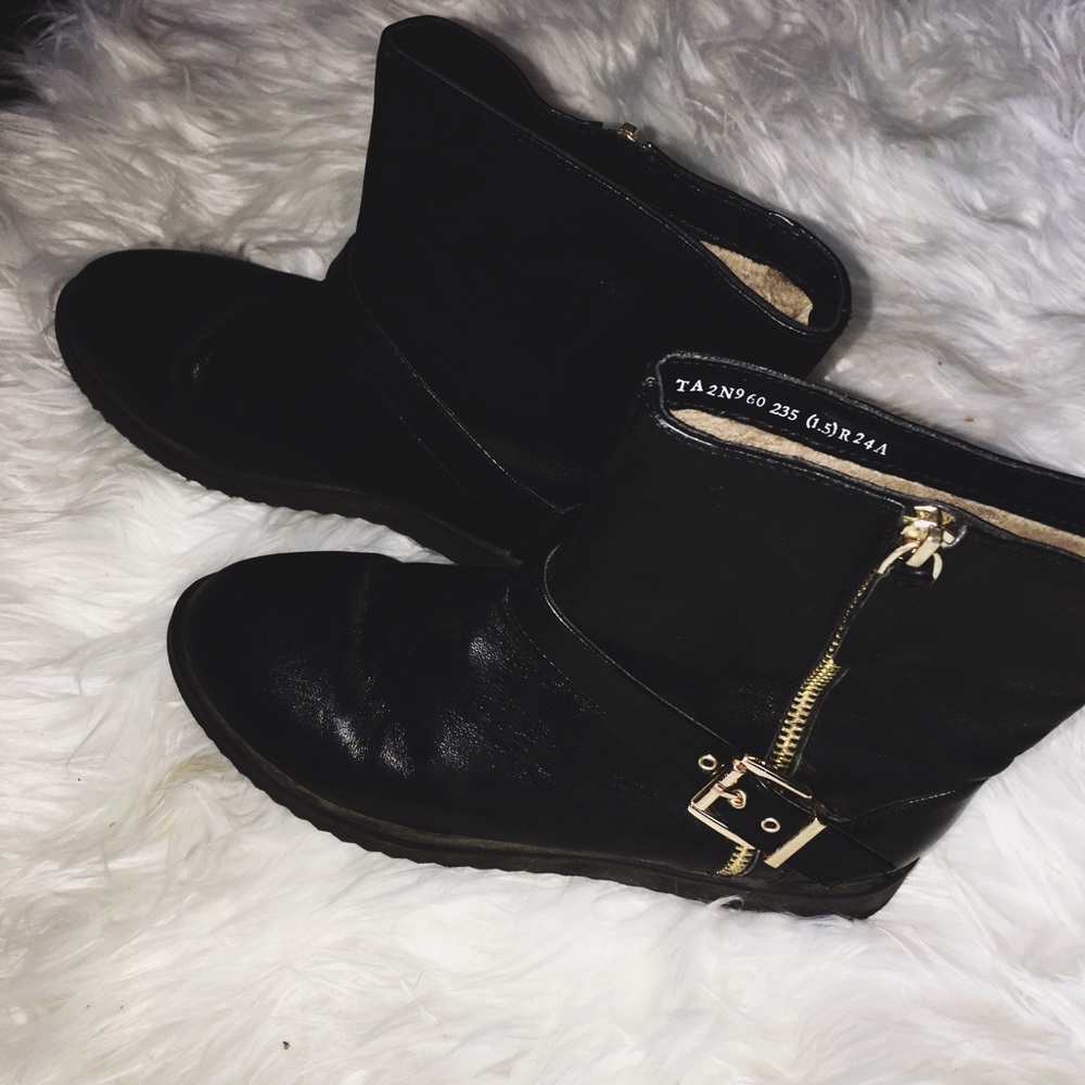 Black and gold boots